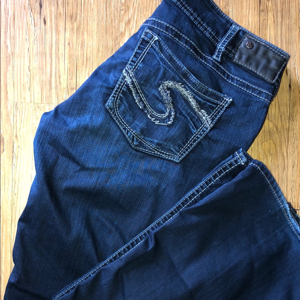 Dark wash silver jeans.